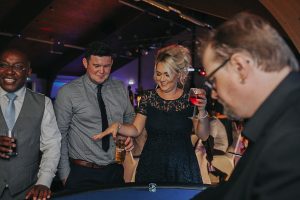 People enjoying a Blackjack Table.