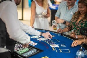 Blackjack Hire guests enjoying a casino table at a party with Fun Casino Fun