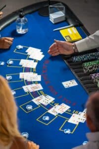 Blackjack table with players and dealer.