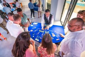 Blackjack Hire table surrounded by guests enjoying a casino party
