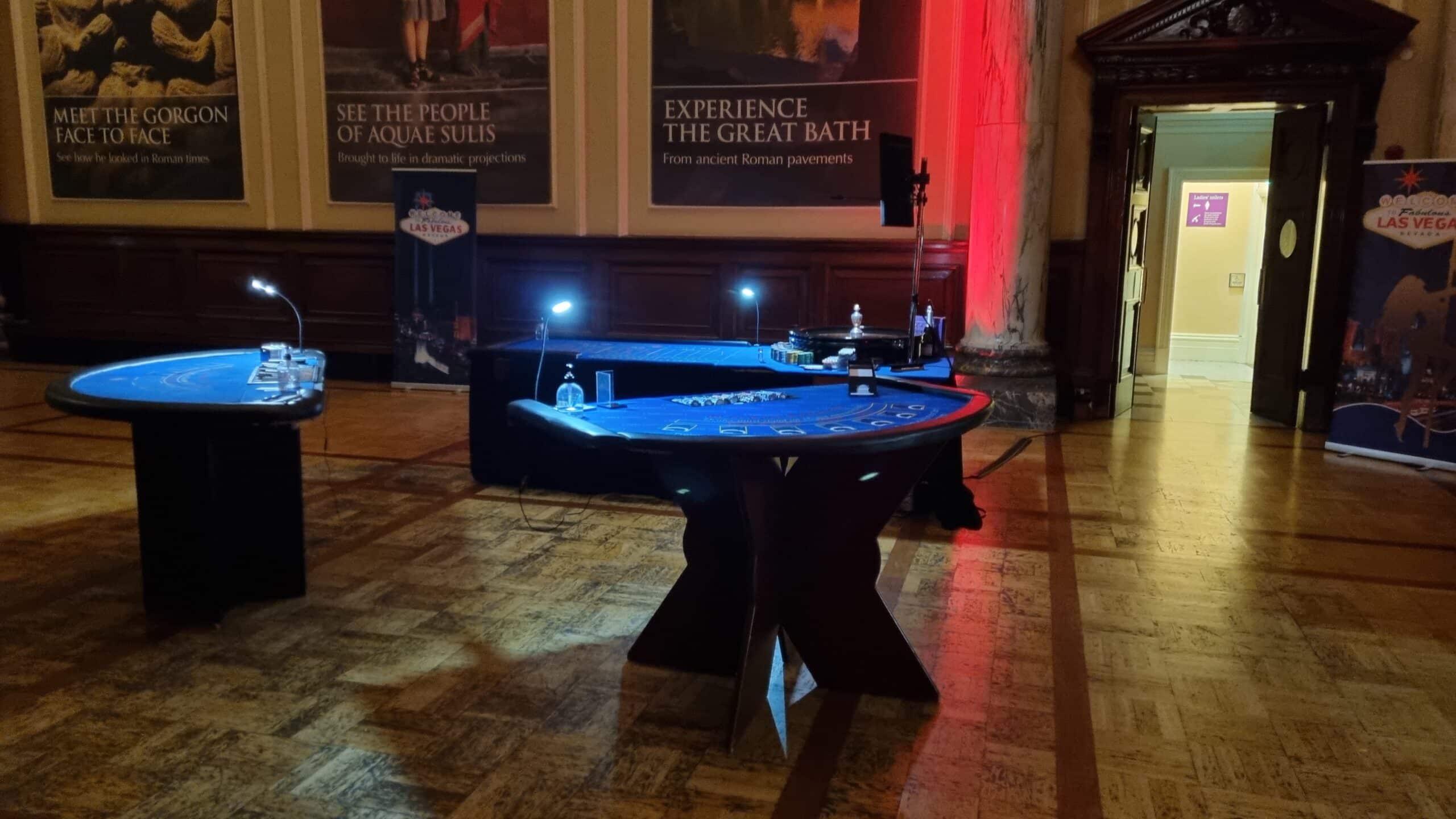 Fun casino blackjack tables set up with Las Vegas banners at the Pump Room, Roman Baths, Bath