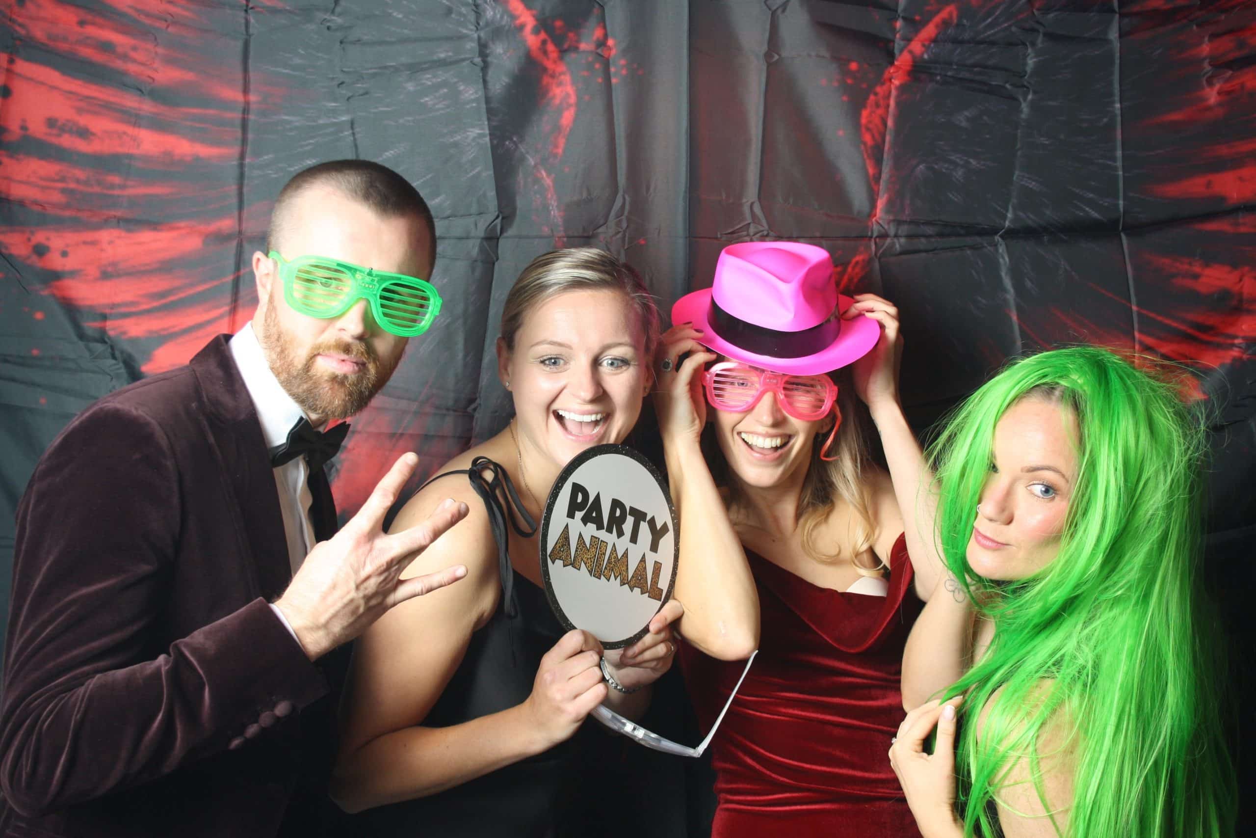 Four friends in fun costumes posing for a photo.