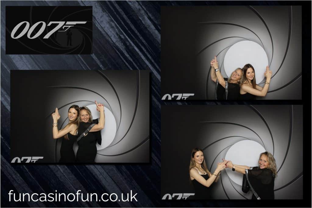 Guests laughing together at an open-air photo booth