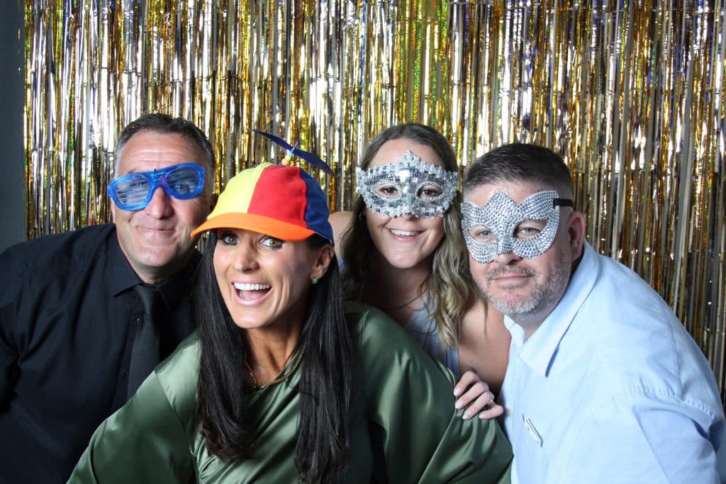 Guests posing together in the open-air photo booth