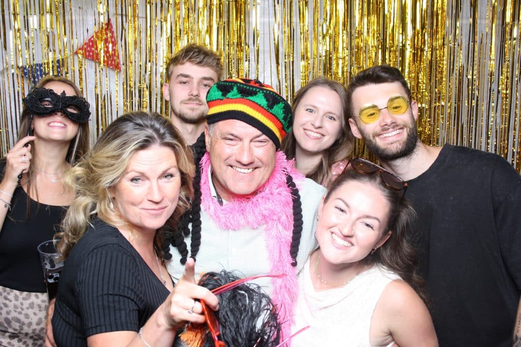 Guests having fun with props, a highlight of photo booth hire Wiltshire events